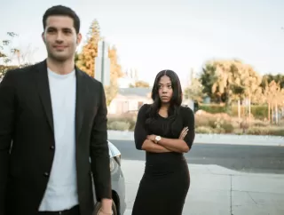 Couple discussing past conflicts, perceiving emotional strain in their relationship