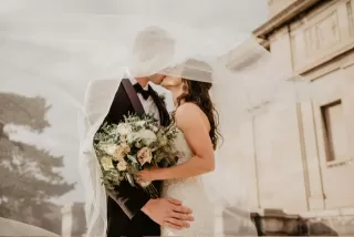 Couple discussing wedding plans while displaying mixed emotions and anxiety signals