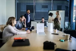 Person pauses thoughtfully in conversation, embodying the hesitance after a question is asked