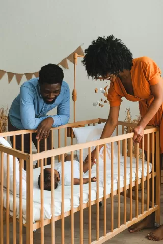 Parents reflecting on their emotional distance during a quiet evening at home