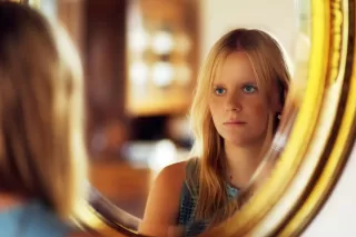 Individual contemplating repeated relationship patterns influenced by childhood experiences