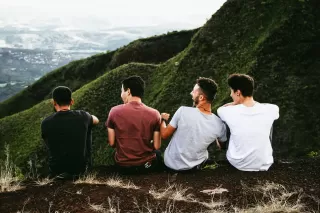 Group of friends supporting each other, highlighting how friendships improve men's mental health