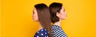 Women engaging in social interactions while interpreting relationship signals for male attention
