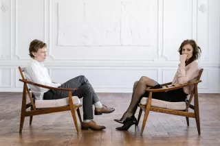 Couple enjoying a moment of intimacy yet feeling emotionally distant.