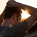 Individual grappling with guilt over their partner's troubling actions in a relationship