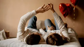 Partner looking contemplative while checking their phone, reflecting on texting frequency changes