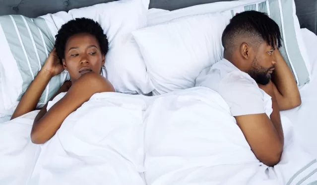Individual contemplating partner's response to expressed intimacy needs and withdrawal signals