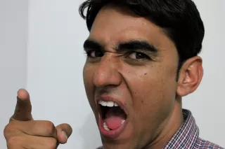 Man expressing frustration instead of discussing feelings during a relationship conflict