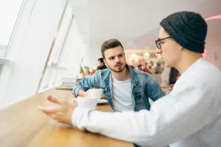 Couple experiencing tension while discussing unresolved forgiveness issues in their relationship