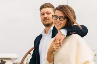 Couple enjoying a cozy dinner, unaware of quality time's emotional significance in their relationship