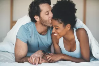 A couple hesitating to communicate their needs during a conversation at home