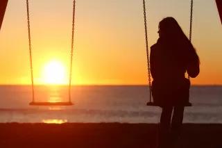A person contemplating alone, showcasing the struggle of wanting time to oneself in relationships
