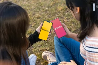 Woman analyzing subtle cues from her online date's messages for signs of genuine interest