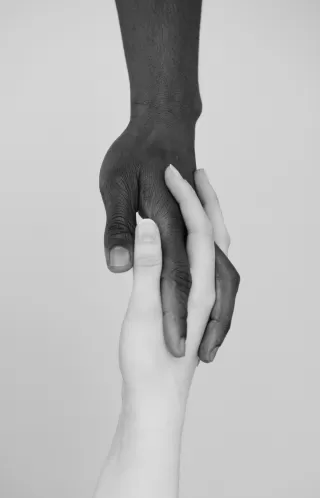 Couple sits in silence, struggling to communicate during a tense racial conversation
