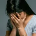 Person feeling anxious while watching unsettling news, reflecting emotional signals of distress