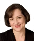 Individual reacting with concern while overhearing gossip about others' behavior
