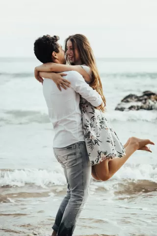 Couple in conversation, one partner appears distant while sharing negative experiences