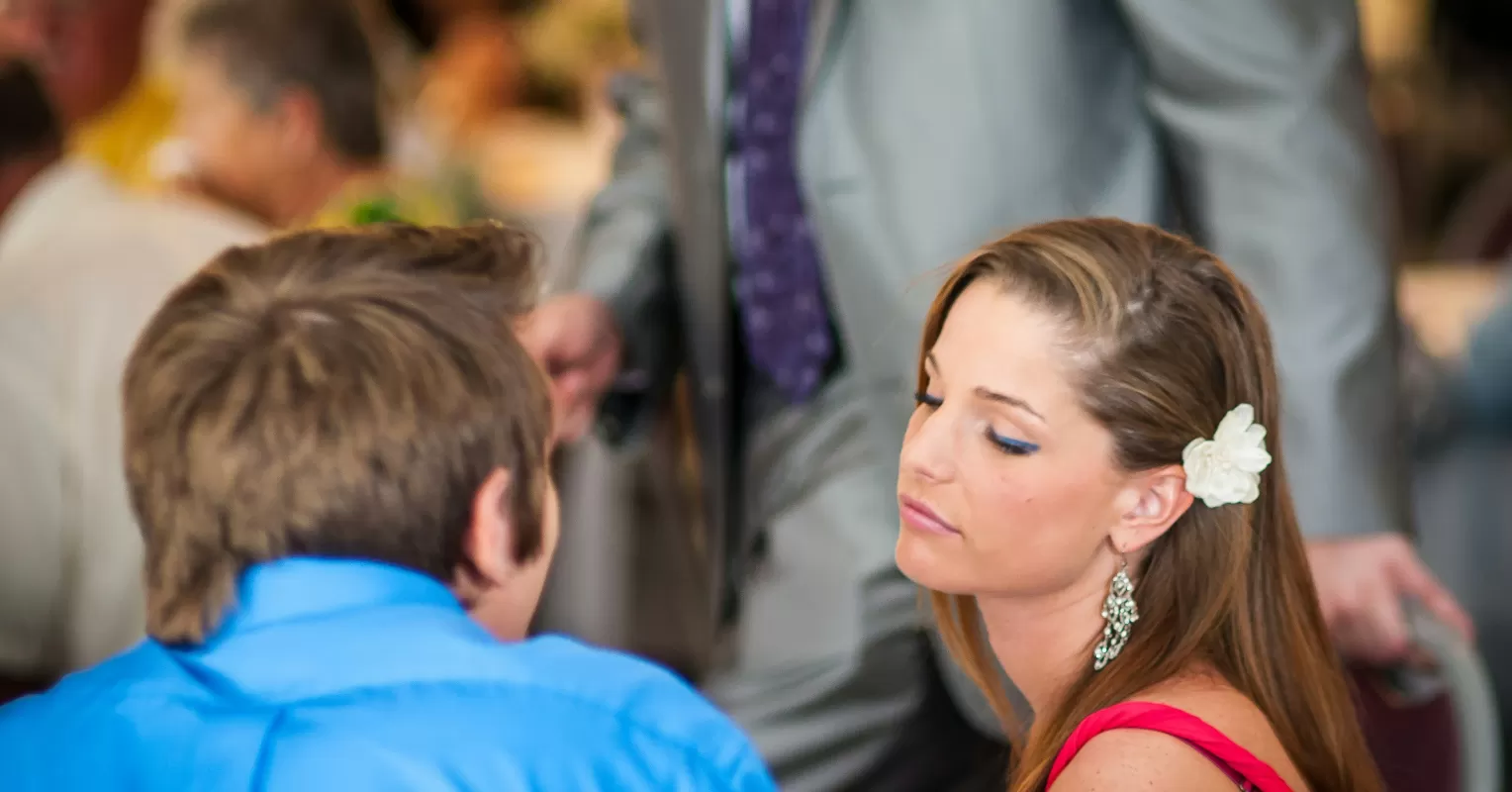 Person reflecting on emotional behavior and meaning connected to signs someone is secretly interested but keeping dis...