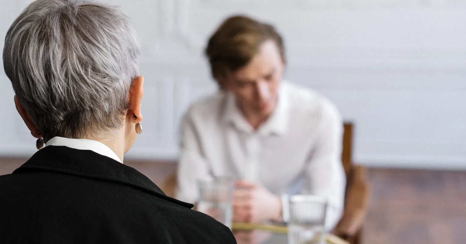 An adult child feeling neglected while parents argue during a divorce, showing emotional distress.