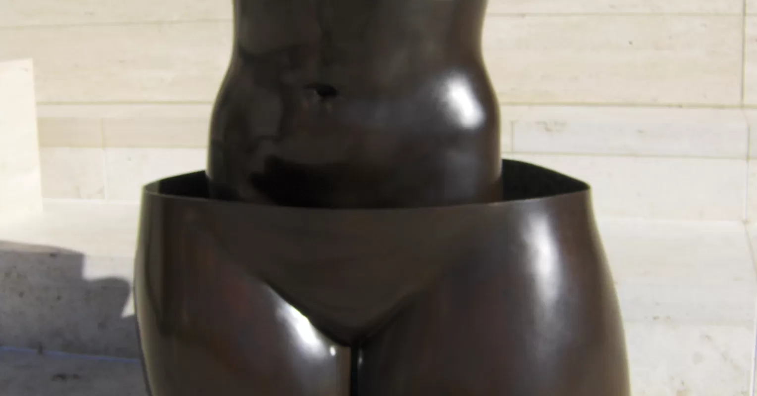 A couple sitting apart, showing signs of emotional disconnection and intimacy issues.