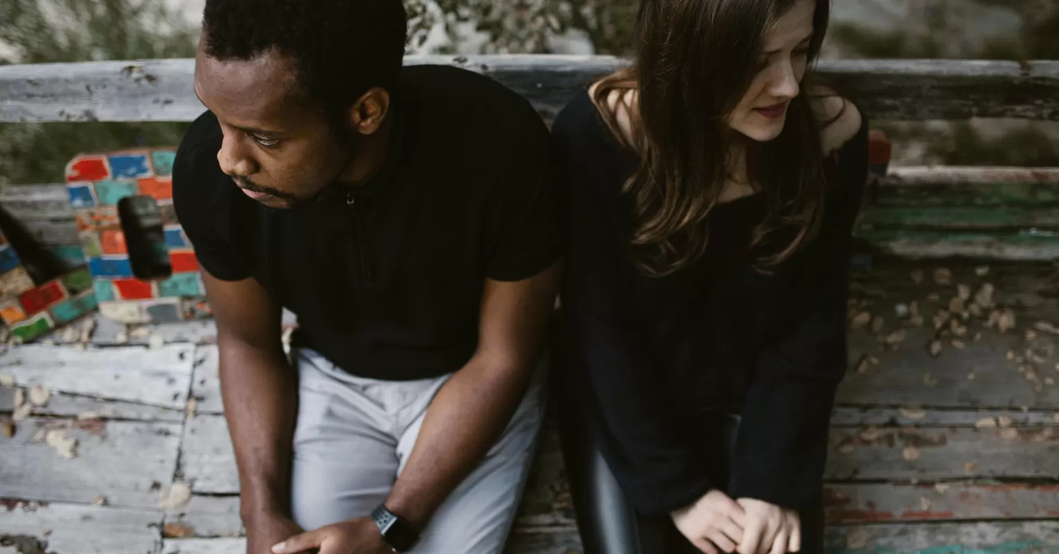 A person contemplating the reasons behind emotional withdrawal in a close relationship