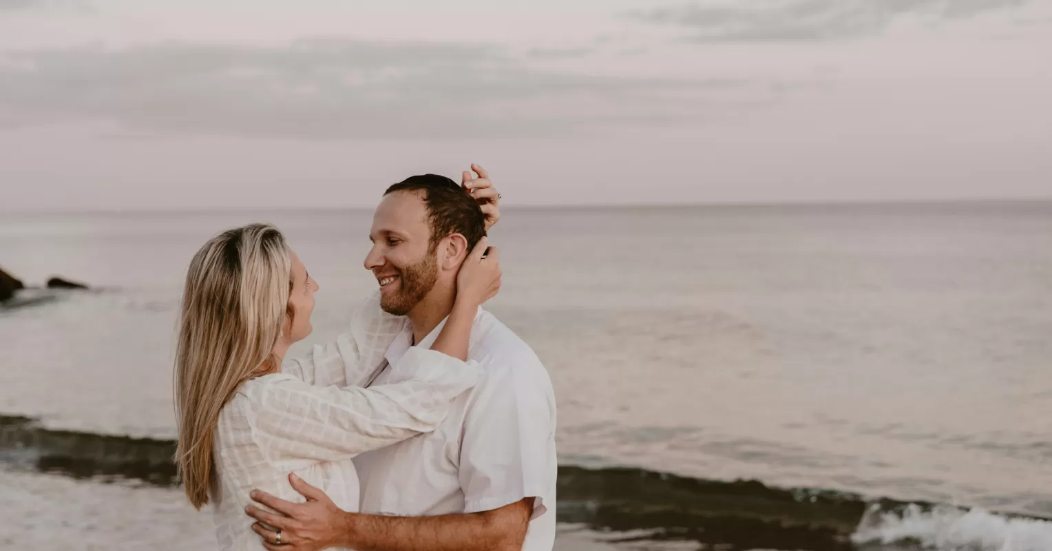 Person contemplating their partner's happiness while feeling neglected in the relationship
