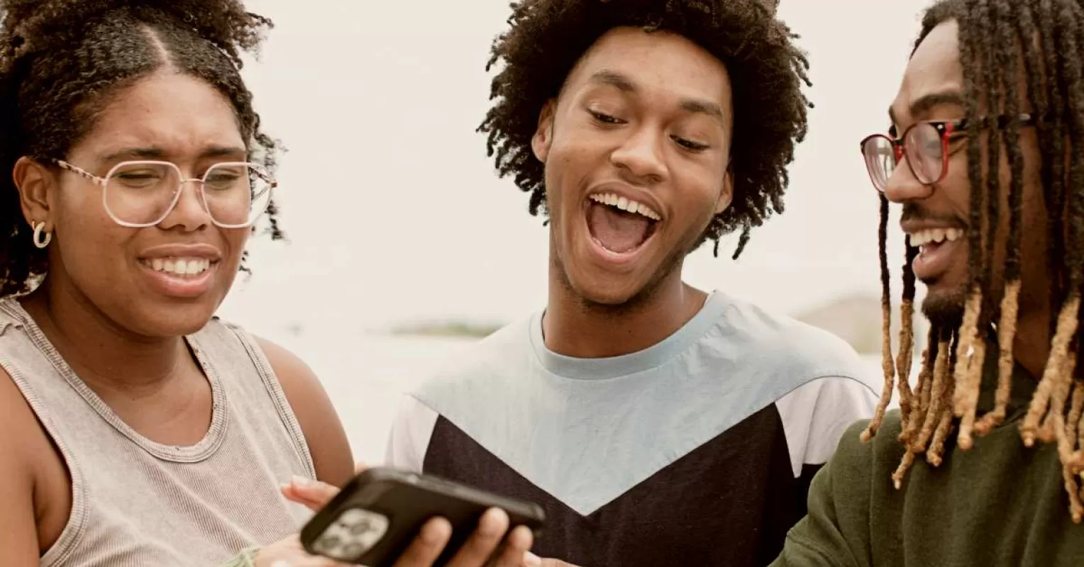 Couple laughing together while discussing sensitive topics and emotional signals in their relationship