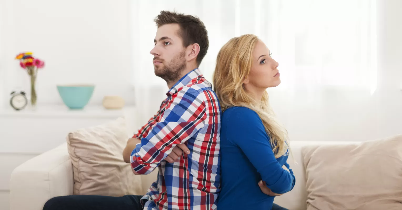 Partner looking away in silence, reflecting on relationship dynamics after conflict