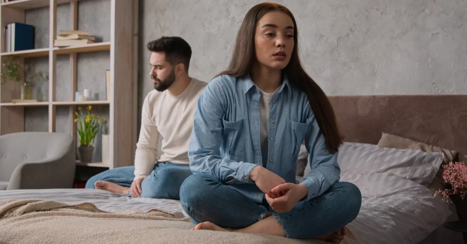 Individual feeling belittled during a public interaction with their partner, revealing emotional distress