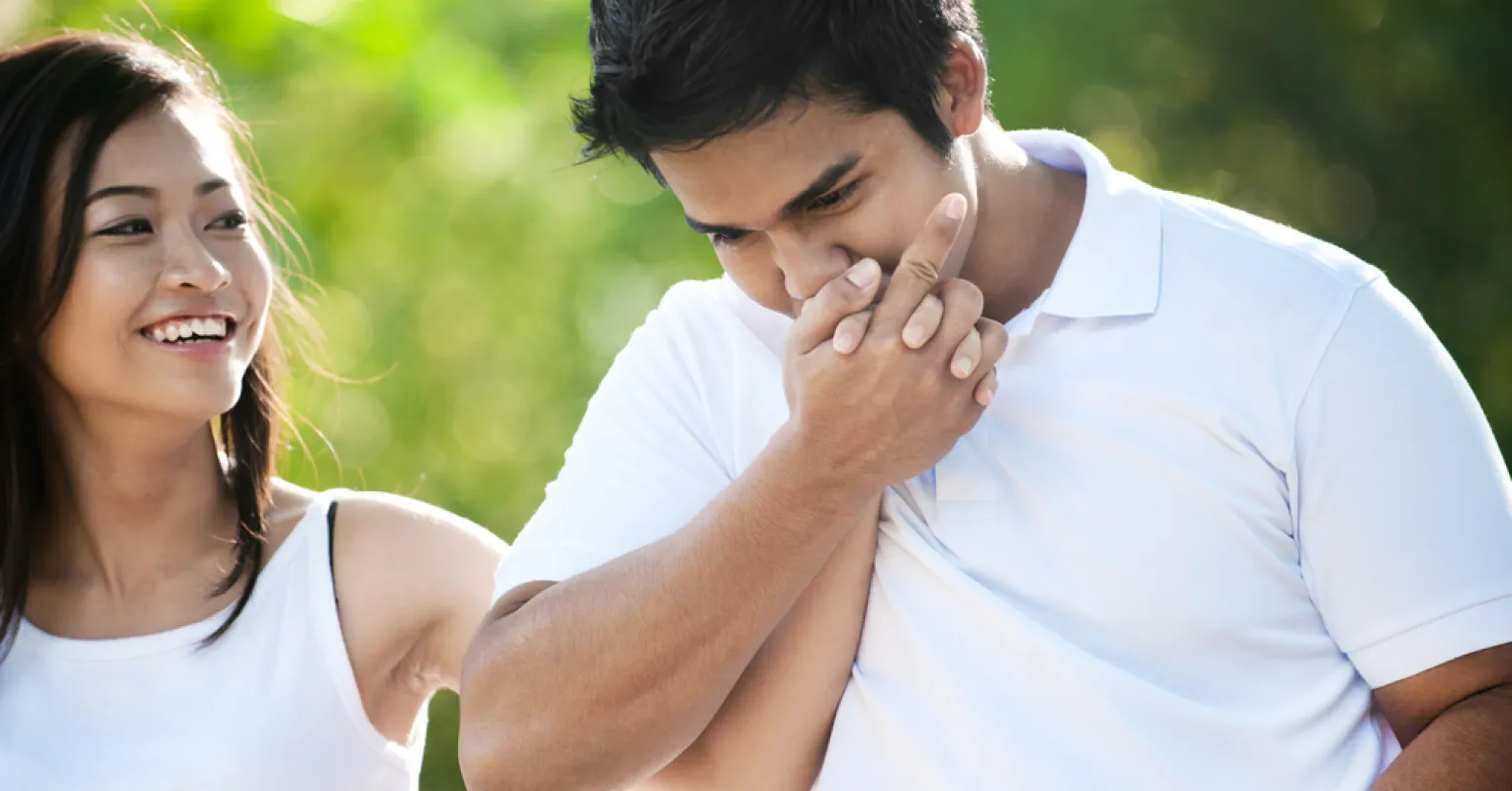 Couple engaged in a conversation, highlighting how one partner interrupts negative patterns