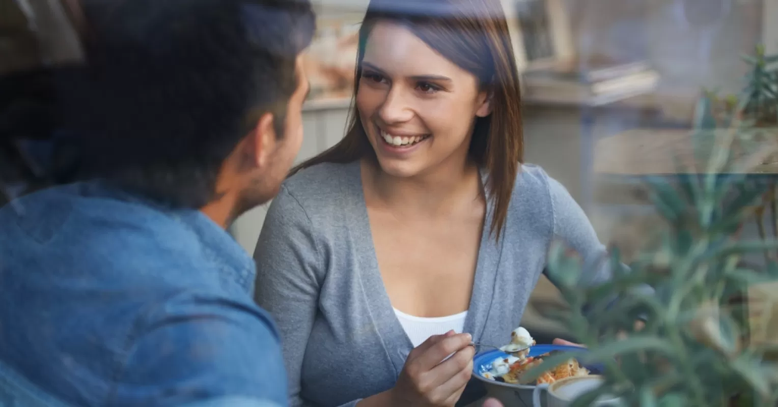 Couple sitting in silence, avoiding emotional discussions, reflecting on relationship signals.