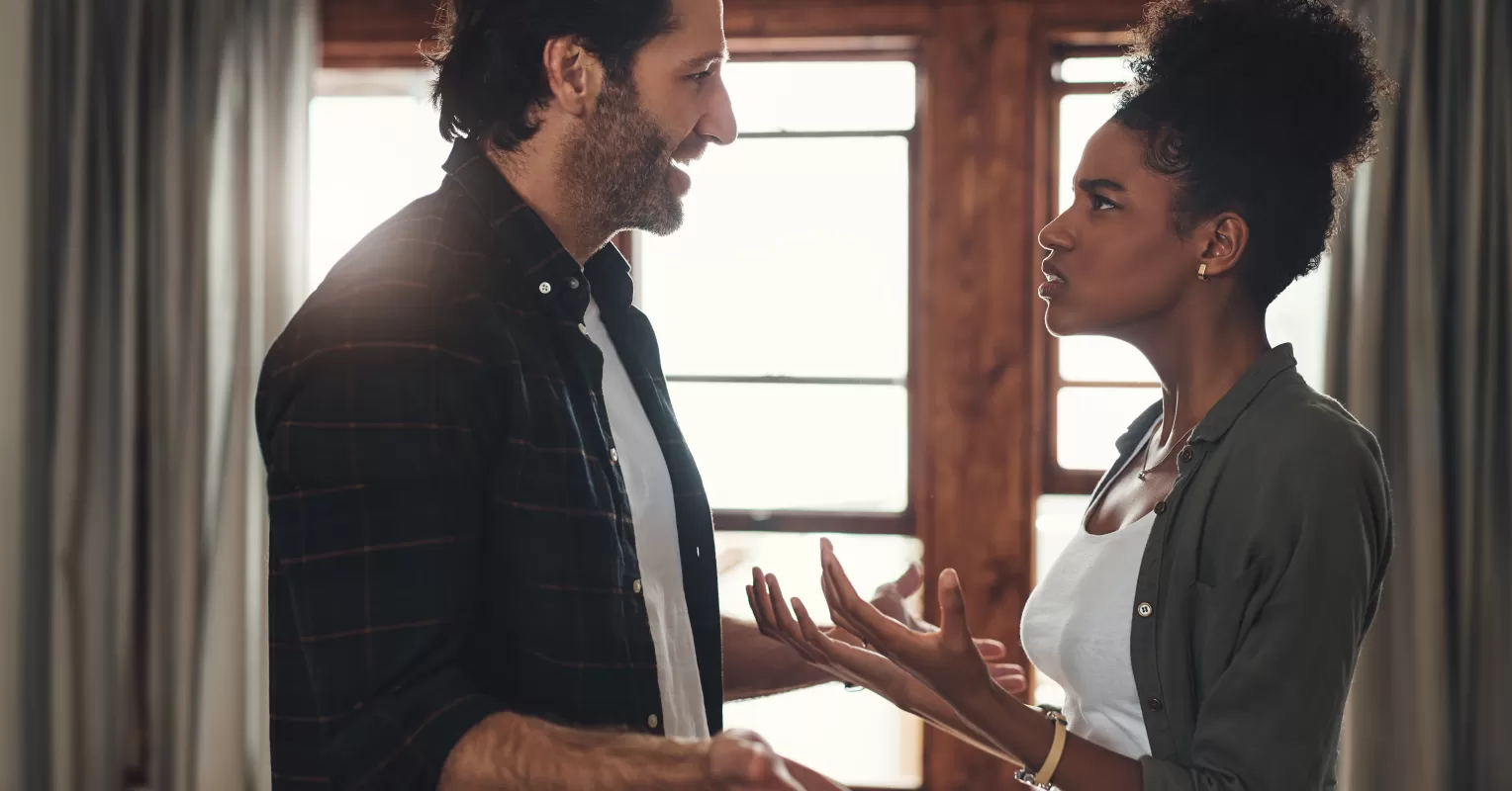 Couple experiencing emotional pain during a heated argument with hurtful words exchanged