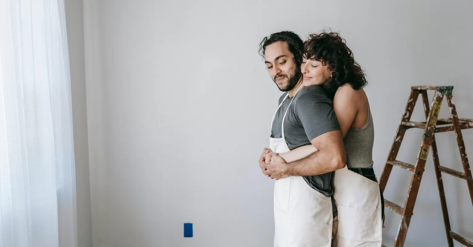 Couple sitting apart, reflecting on unbalanced effort in their relationship dynamics