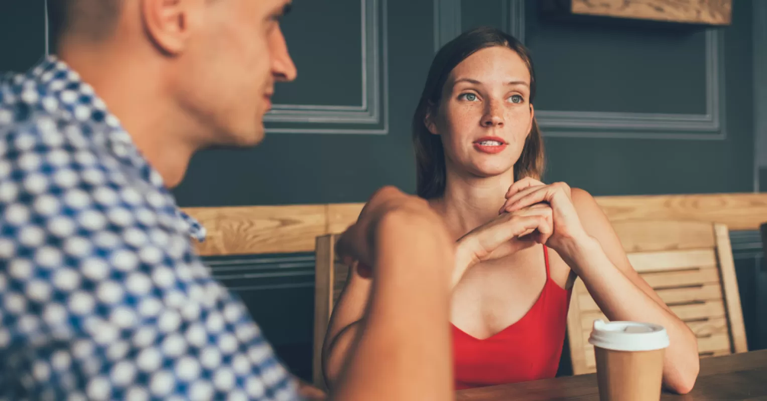 Person contemplating relationship signals before becoming emotionally involved too quickly