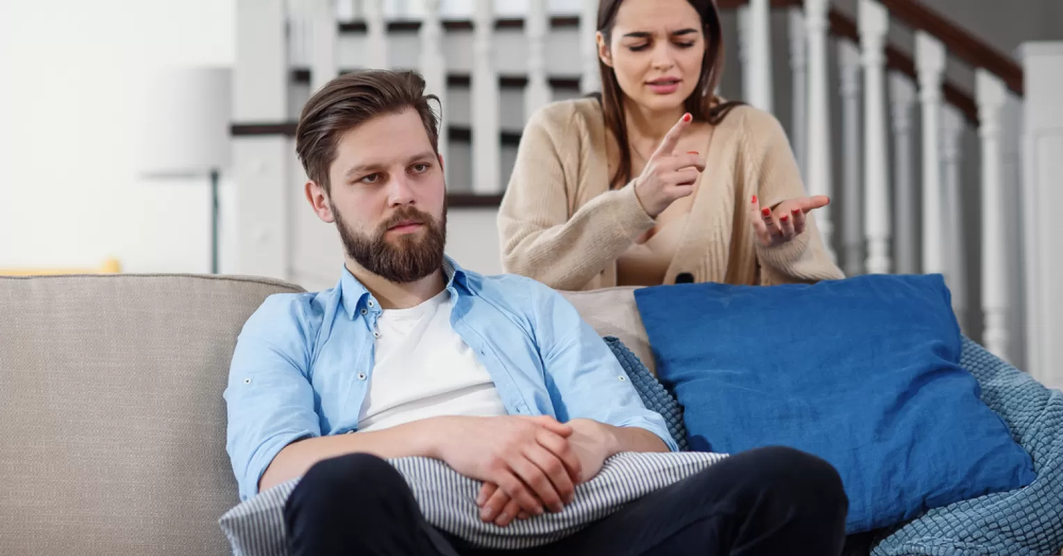Couple engaging in a candid discussion about parent-child relationship dynamics