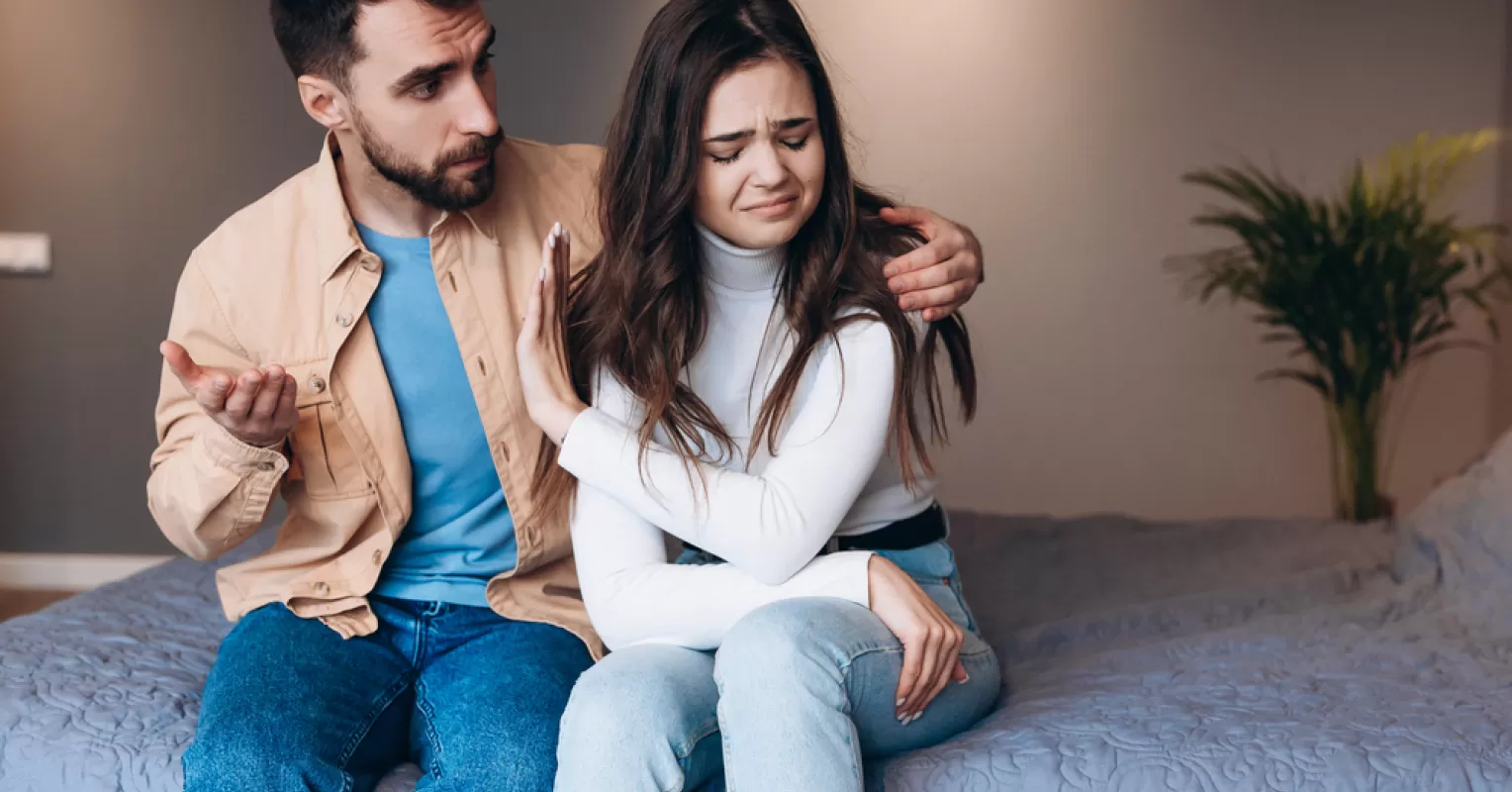 Individual contemplating kindness imbalance while assessing relationship signals with a partner