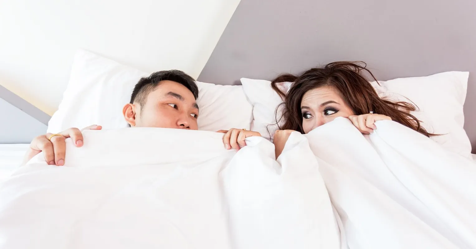 Person reflecting on uncertainty in a relationship connected to what to do when my partner fakes pleasure in