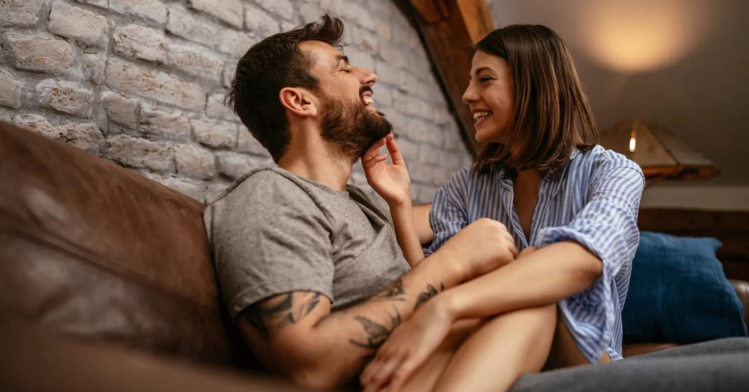 Person hesitating to ask a partner deeper questions, illustrating relationship signals.