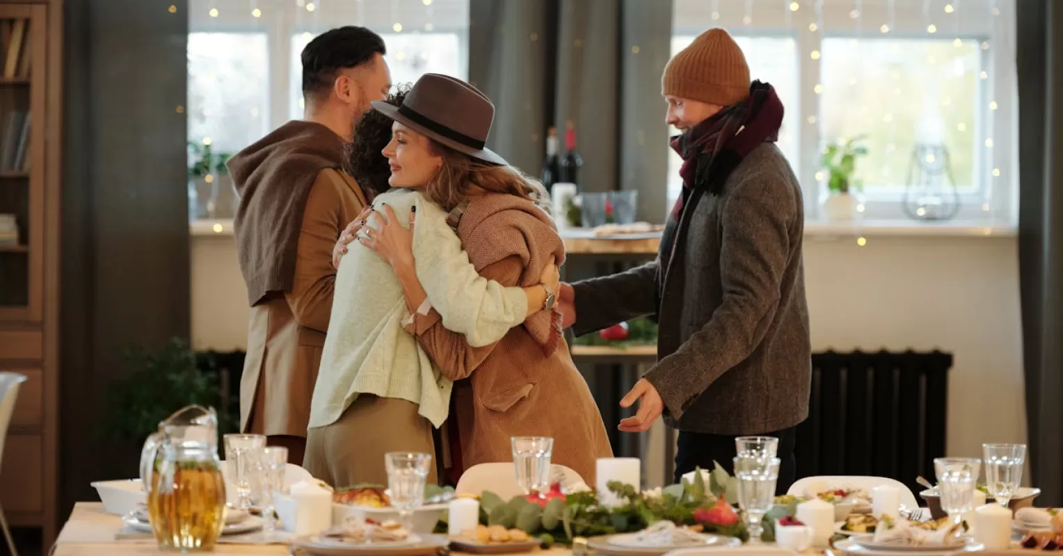 A family gathered at the dining table, experiencing tension during holiday conversations.