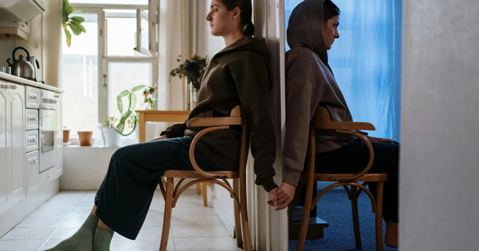 Person quietly reflecting on anxious emotional patterns connected to i feel anxious when my twin and i are