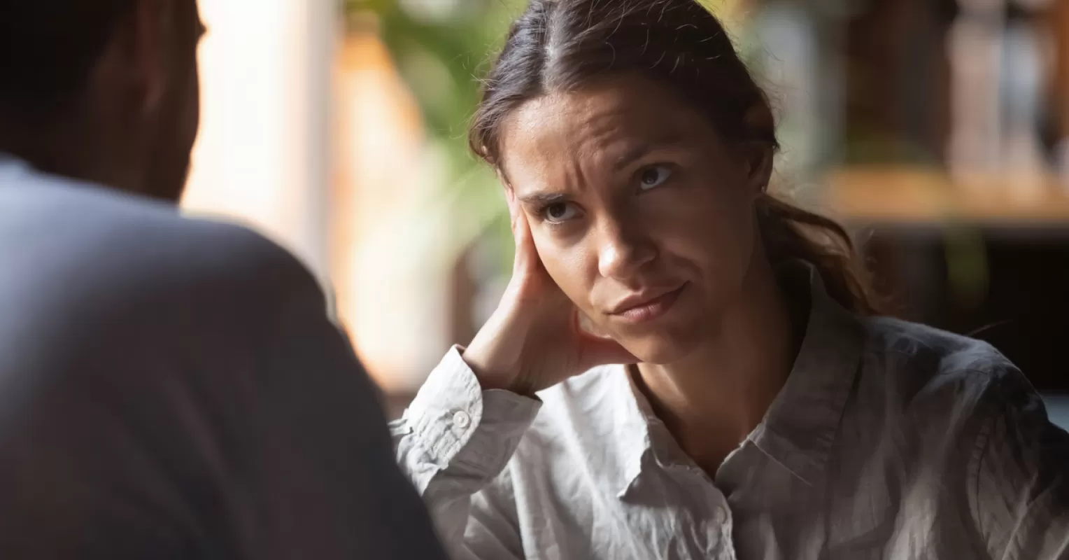 Individual feeling emotionally drained while attempting to communicate with their partner, reflecting relationship si...
