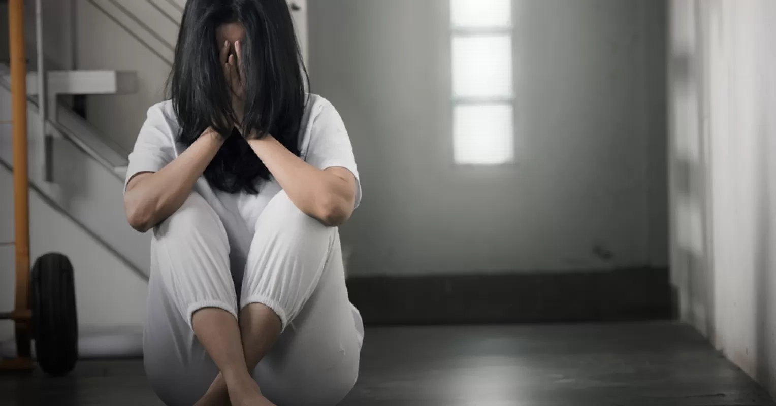 Person feeling conflicted while confronting their partner's shame tactics in a tense situation
