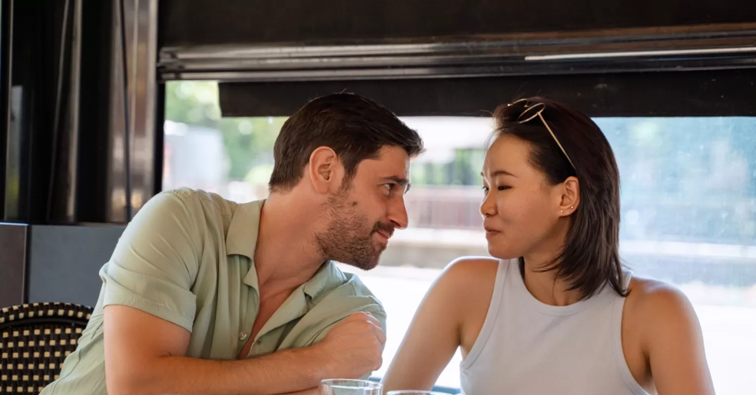 Individual contemplating insecurities about their partner's affection in a cozy setting