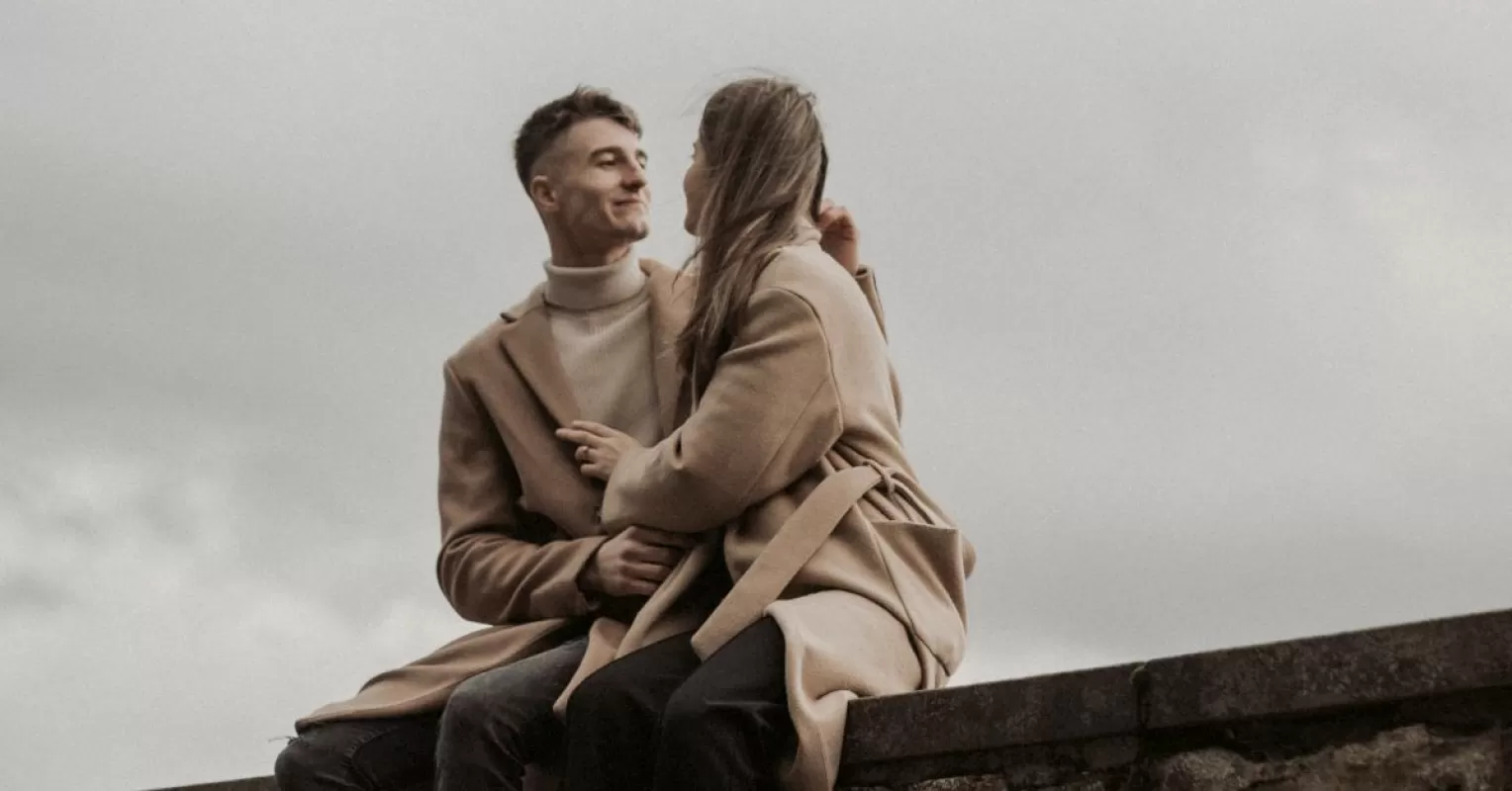 Person contemplating the urge to fix their partner's emotions in a tense relationship