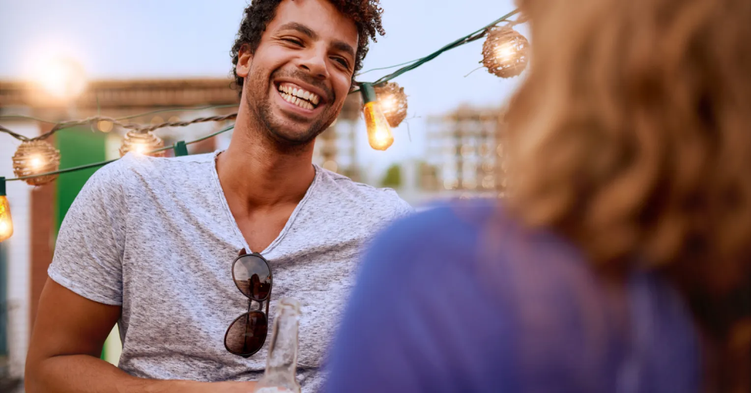 Individual experiencing heightened attraction as they witness kindness and warmth in another person