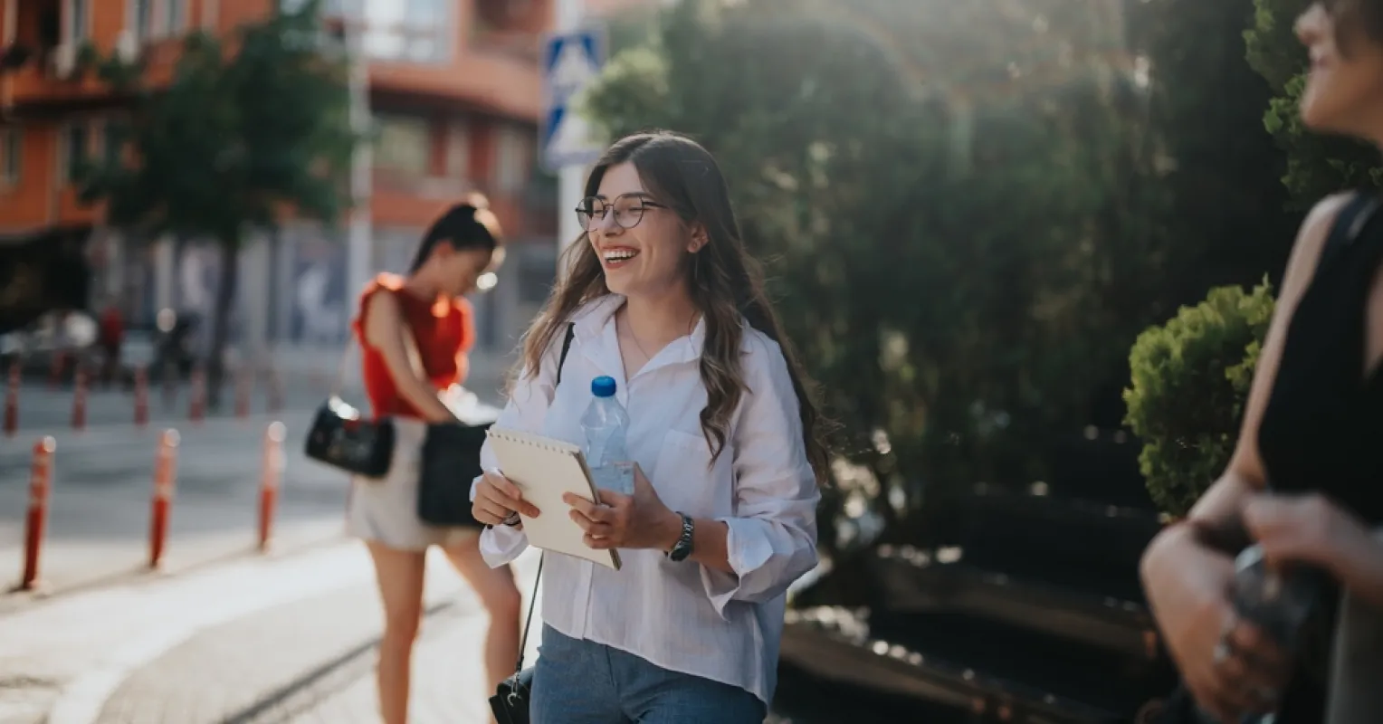 Individual standing nervously at a social gathering, avoiding small talk despite wanting to connect