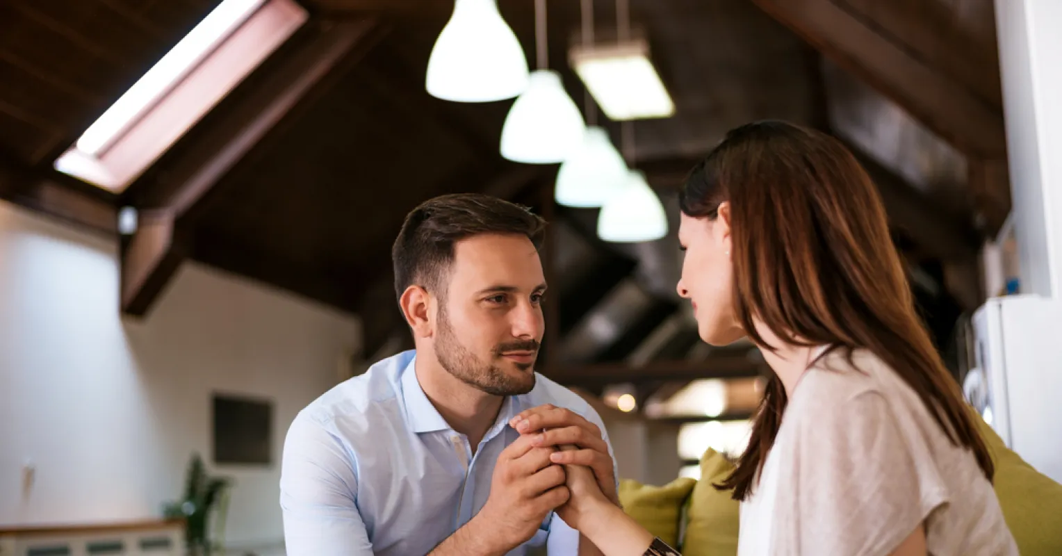Couple sitting in silence, reflecting on why many couples feel unhappy despite being together