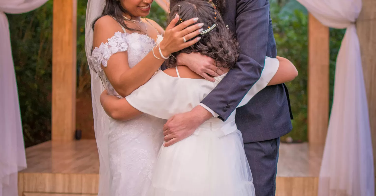 A blended family navigating emotions at a remarriage ceremony, highlighting stepchildren's feelings