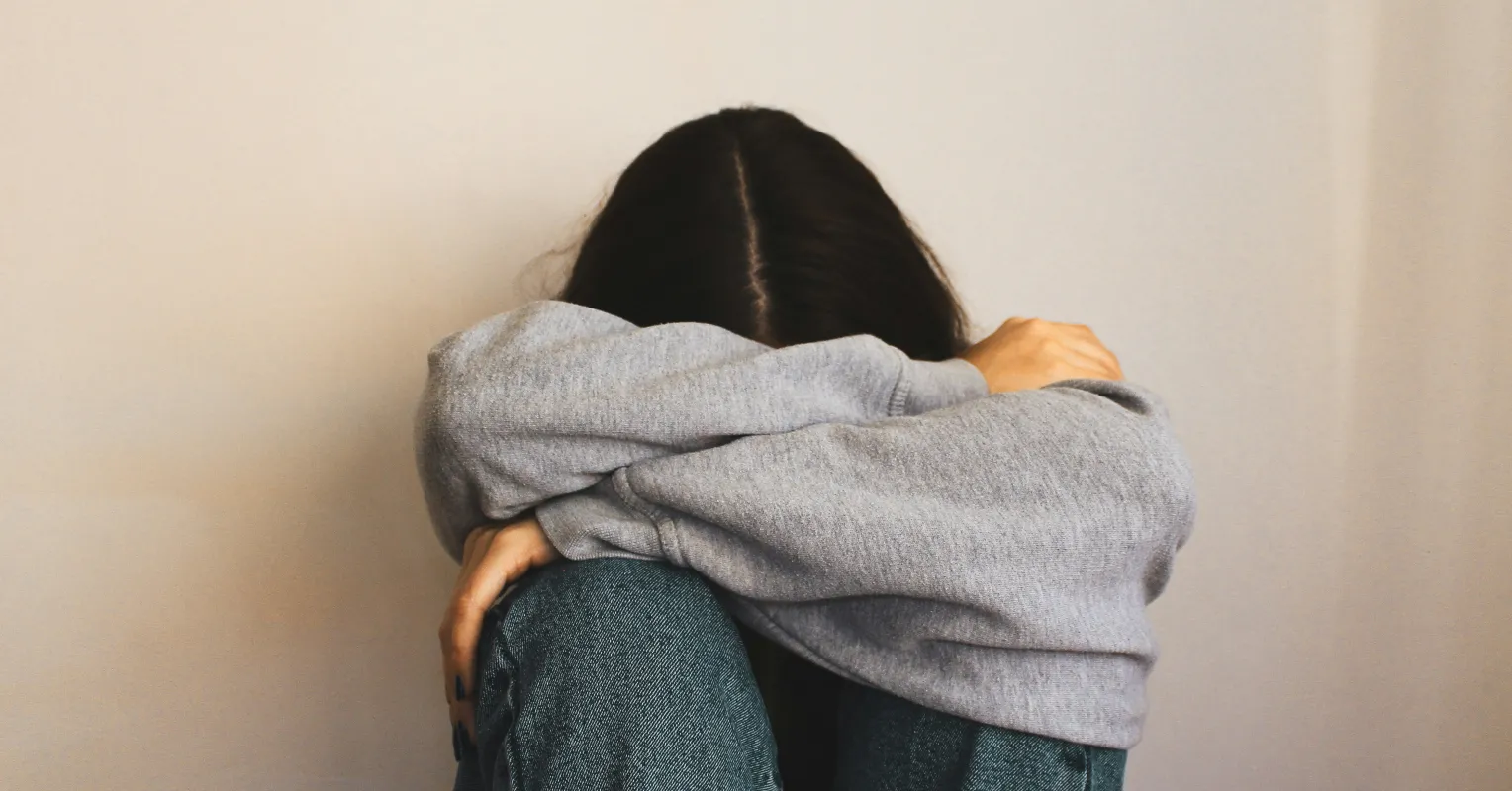 Couple sitting in silence, highlighting emotional unavailability in relationships over time
