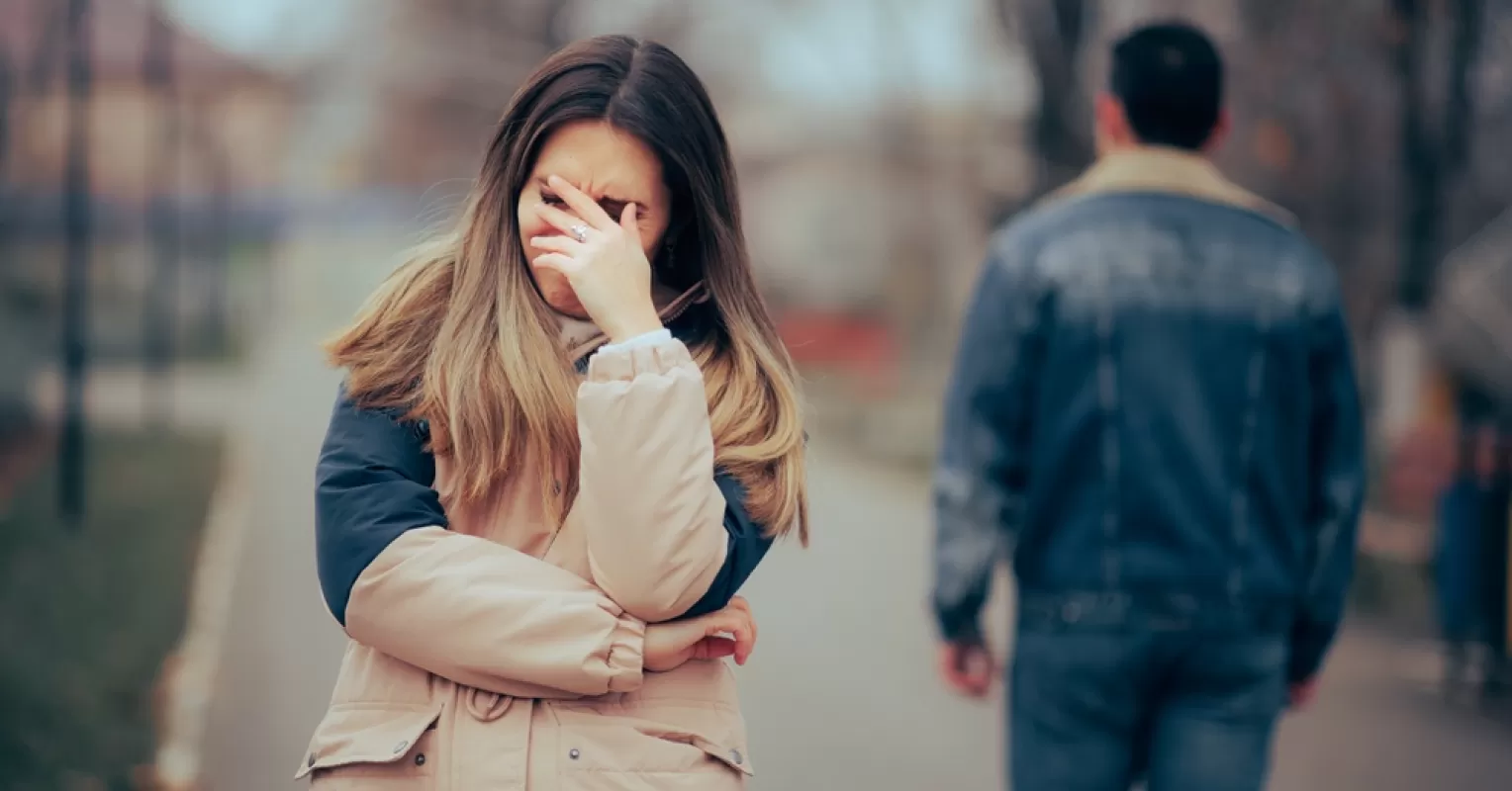 Couple looking away during a conversation, reflecting on fading attraction in their relationship